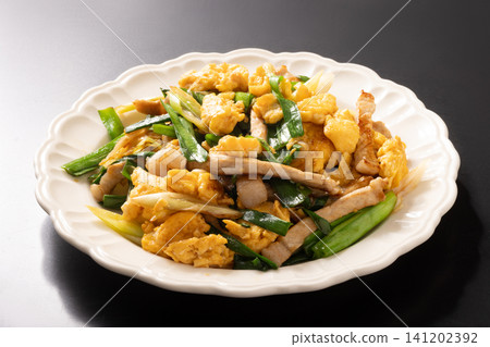 Stir-fried pork and scrambled eggs with wild yam greens Stir-fried pork and scrambled eggs with wild yam greens 141202392