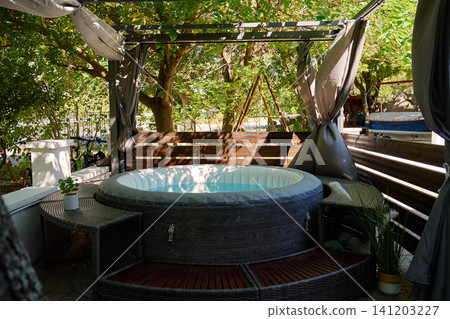 Inflatable Hot Tub in Garden with Outdoor Seating Inflatable Hot Tub in Garden with Outdoor Seating 141203227