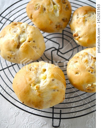 Freshly baked whole wheat bread with walnuts and cheese. Freshly baked whole wheat bread with walnuts and cheese. 141203363