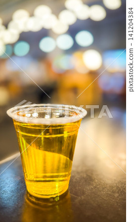 A glass of beer on the table A glass of beer on the table 141204384