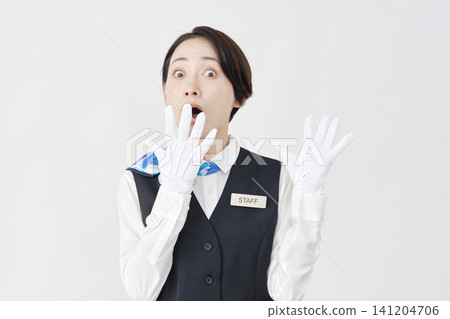 Surprised female staff member (receptionist/bus guide) - white background Surprised female staff member (receptionist/bus guide) - white background 141204706