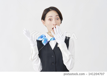 Surprised female staff member (receptionist/bus guide) - white background Surprised female staff member (receptionist/bus guide) - white background 141204707