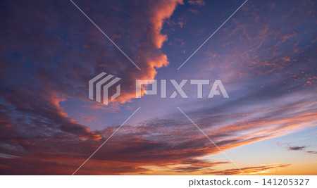Beautiful colorful dramatic cloud formation in purple sky during peaceful sunset over natural landscape of utah usa creating deeply serene and awe inspiring atmosphere of orange light Beautiful colorful dramatic cloud formation in purple sky during peaceful sunset over natural landscape of utah usa creating deeply serene and awe inspiring atmosphere of orange light 141205327