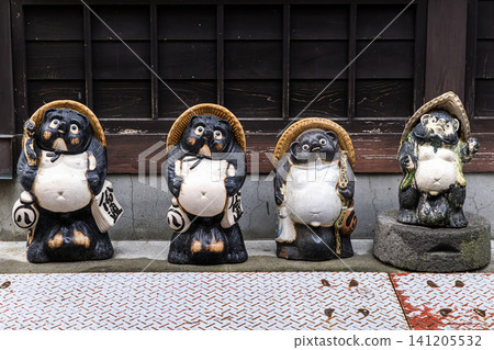 Tanuki statues symbolizing good fortune Tanuki statues symbolizing good fortune 141205532
