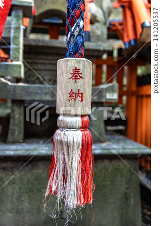Suzu bell rope hanging at fushimi inari taisha shrine Suzu bell rope hanging at fushimi inari taisha shrine 141205537