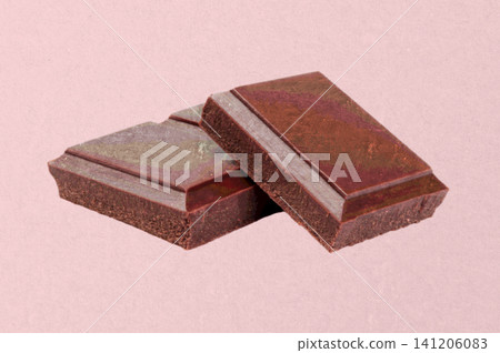 Textured chocolate cubes in Risograph style. Vintage print effect with grain texture for food, packaging, branding and creative design Textured chocolate cubes in Risograph style. Vintage print effect with grain texture for food, packaging, branding and creative design 141206083