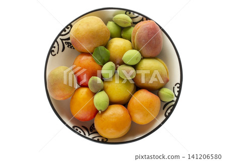 green fresh apricots and ripe apricots in the plate green fresh apricots and ripe apricots in the plate 141206580