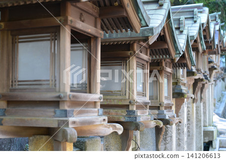 Details of traditional wooden lanterns lining the approach to Hozanji Temple in Ikoma City, Nara Prefecture Details of traditional wooden lanterns lining the approach to Hozanji Temple in Ikoma City, Nara Prefecture 141206613