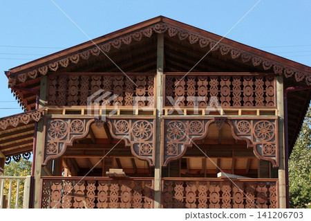 Balcony architectural detail. Wooden garden house. Balcony architectural detail. Wooden garden house. 141206703
