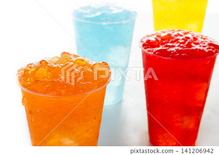 Colorful Frozen Slush Drinks in Plastic Cups Colorful Frozen Slush Drinks in Plastic Cups 141206942