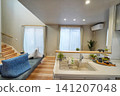 Living room with an open ceiling and stylish sofa 141207048