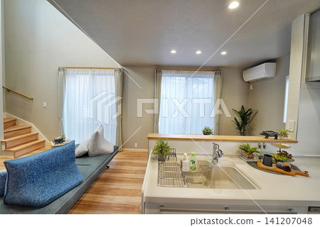 Living room with an open ceiling and stylish sofa Living room with an open ceiling and stylish sofa 141207048