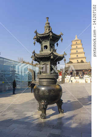 Xi'an, China - Dec 31, 2024 : View of Big Wild Goose Pagoda against blue sky in Xian, China on Dec 31, 2024. Xi'an, China - Dec 31, 2024 : View of Big Wild Goose Pagoda against blue sky in Xian, China on Dec 31, 2024. 141207102