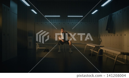 Tired Adaptive Athlete Resting in Empty Locker Room with Cinematic Lighting Tired Adaptive Athlete Resting in Empty Locker Room with Cinematic Lighting 141208004