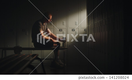 Amputee Athlete Drinking Water and Watching Sports Videos on Smartphone 141208024