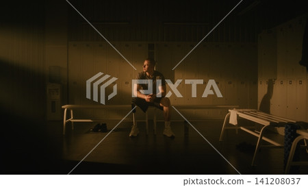 Determined Male Athlete with Prosthetic Leg Practicing Mindfulness Before Training Determined Male Athlete with Prosthetic Leg Practicing Mindfulness Before Training 141208037