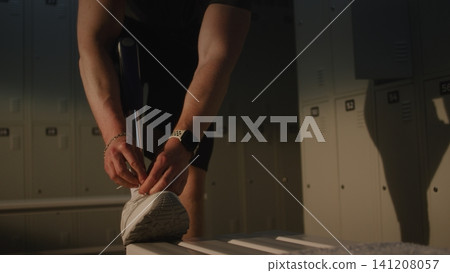 Man with Bionic Leg Prosthesis Adjusting Sports Shoes for Training Man with Bionic Leg Prosthesis Adjusting Sports Shoes for Training 141208057
