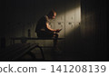 Adaptive Athlete Filling Out Rehabilitation Progress Diary on Smartphone 141208139