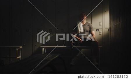Recovery of Young Man with Bionic Leg in Locker Room Recovery of Young Man with Bionic Leg in Locker Room 141208150