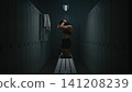 Athletic Woman Stretching Neck and Chest Muscles in Gym Locker Room 141208239
