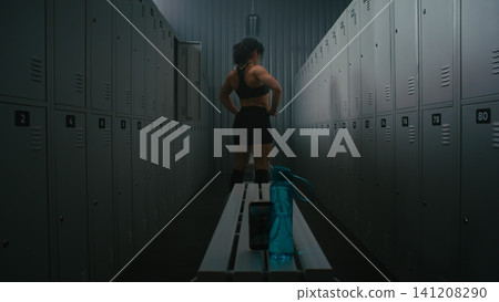 Female Fitness Influencer Recording Video of Flexing Muscles in Locker Room Female Fitness Influencer Recording Video of Flexing Muscles in Locker Room 141208290