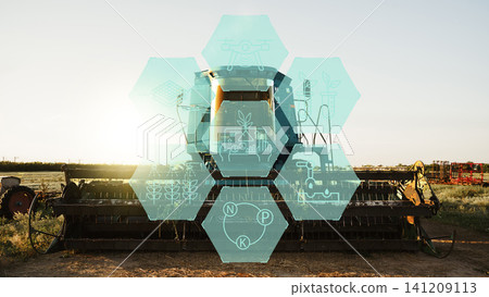 Smart farm equipment with technology icons at sunset in agricultural field 141209113