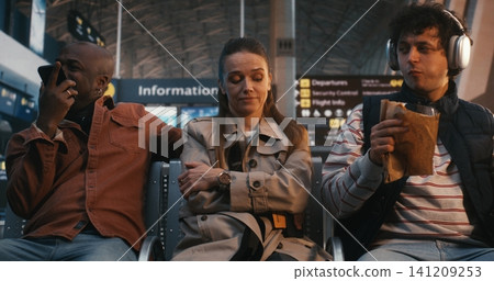 Neurodivergent Woman Experiencing Sensory Overload at Busy Airport Gate Neurodivergent Woman Experiencing Sensory Overload at Busy Airport Gate 141209253