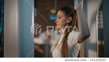 Female Traveler in High Tech Millimeter Wave Scanner at Departure Hall Female Traveler in High Tech Millimeter Wave Scanner at Departure Hall 141209287
