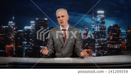 Mature Male Anchor in Grey Suit and Red Tie Hosting Weekly Analytical News Program in TV Studio Mature Male Anchor in Grey Suit and Red Tie Hosting Weekly Analytical News Program in TV Studio 141209359
