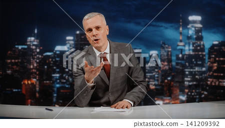 Charismatic Political Talk Show Host Leads Intense Live Debate in Modern Television Studio Charismatic Political Talk Show Host Leads Intense Live Debate in Modern Television Studio 141209392