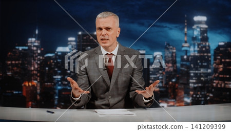 Charismatic Political Talk Show Host Leads Intense Live Debate in Modern Television Studio Charismatic Political Talk Show Host Leads Intense Live Debate in Modern Television Studio 141209399