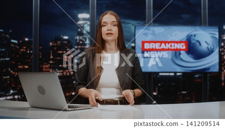 Confident Female Journalist Presenting Breaking News Report in Modern Television Studio Confident Female Journalist Presenting Breaking News Report in Modern Television Studio 141209514