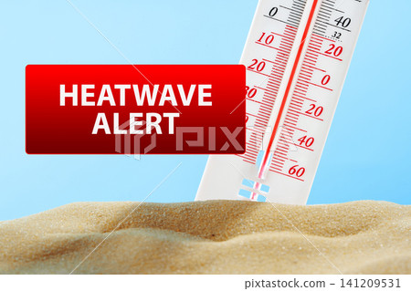 Heatwave alert showing thermometer reading high temperature over sand background Heatwave alert showing thermometer reading high temperature over sand background 141209531