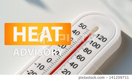 Heat advisory notice with a thermometer showing high temperature during a summer heatwave in a city 141209731
