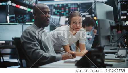 Two Professional Brokers Analyzing Big Data Trends on Multi Monitor Dashboard Two Professional Brokers Analyzing Big Data Trends on Multi Monitor Dashboard 141209789