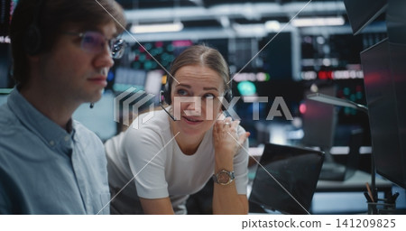Male and Female Brokers Analyzing Real Time Stock Data Together Male and Female Brokers Analyzing Real Time Stock Data Together 141209825
