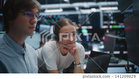 Male and Female Brokers Analyzing Real Time Stock Data Together Male and Female Brokers Analyzing Real Time Stock Data Together 141209829