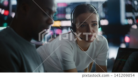 Diverse Team Traders Discussing Urgent Market Strategy During Volatility Diverse Team Traders Discussing Urgent Market Strategy During Volatility 141209854