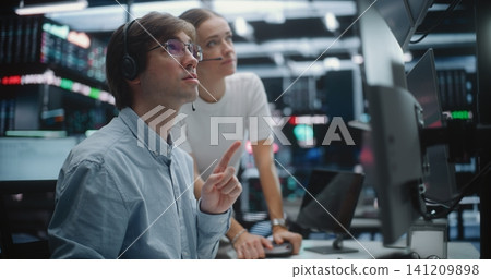 Financial Analysts Collaborating and Discussing Market Trends at Trading Desk Financial Analysts Collaborating and Discussing Market Trends at Trading Desk 141209898