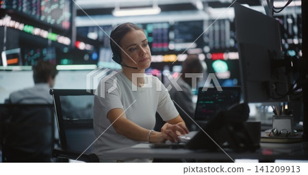 Distressed Female Trader Calling on Desk Phone During Sudden Stock Market Crash Distressed Female Trader Calling on Desk Phone During Sudden Stock Market Crash 141209913