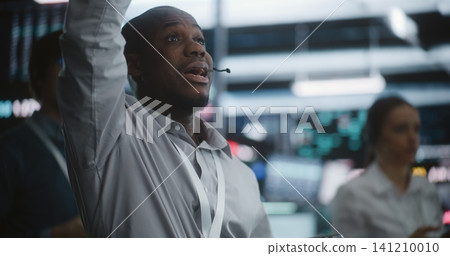 Diverse Trading Team Reacting Simultaneously to Urgent Market Shift in Exchange Pit Diverse Trading Team Reacting Simultaneously to Urgent Market Shift in Exchange Pit 141210010