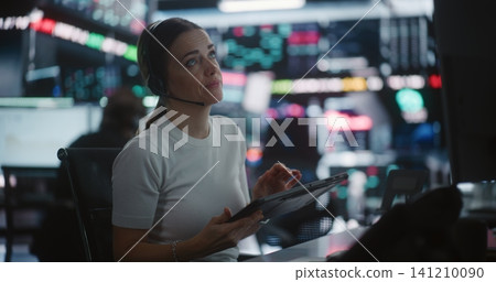 Female Trader Works in Modern Stock Exchange Female Trader Works in Modern Stock Exchange 141210090