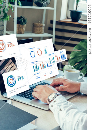 Data analysis on a laptop showing statistics for business performance in a workspace 141210093