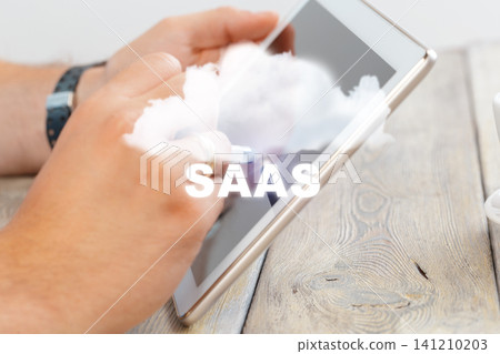 Using tablet for SaaS business solution in modern workspace setting 141210203