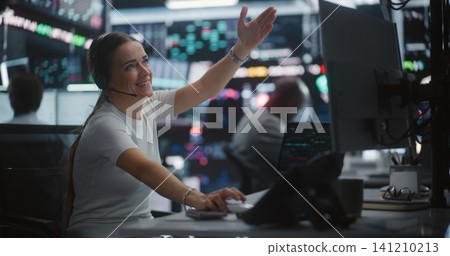 Relieved Female Trader Celebrating Profit Growth at Multi Monitor Workstation Relieved Female Trader Celebrating Profit Growth at Multi Monitor Workstation 141210213