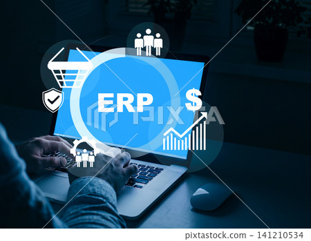 Business person uses laptop to manage ERP system for resource planning success Business person uses laptop to manage ERP system for resource planning success 141210534