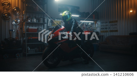 Stylish Woman in Black Leather Outfit Mounting Sport Motorcycle in Professional Garage Stylish Woman in Black Leather Outfit Mounting Sport Motorcycle in Professional Garage 141210606