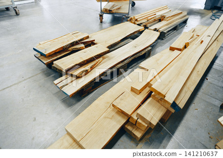Furniture workshop displays various types of wooden planks and boards for crafting furniture Furniture workshop displays various types of wooden planks and boards for crafting furniture 141210637