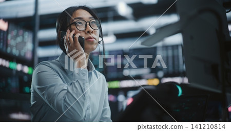 Businesswoman Calling Partner Via Smartphone After Profitable Market Move Businesswoman Calling Partner Via Smartphone After Profitable Market Move 141210814