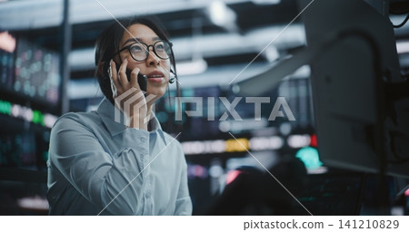 Businesswoman Calling Partner Via Smartphone After Profitable Market Move 141210829